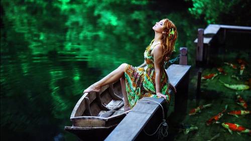 Pretty Girl In Lake With Boat