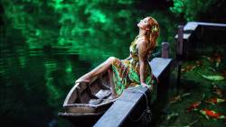 Pretty Girl In Lake With Boat